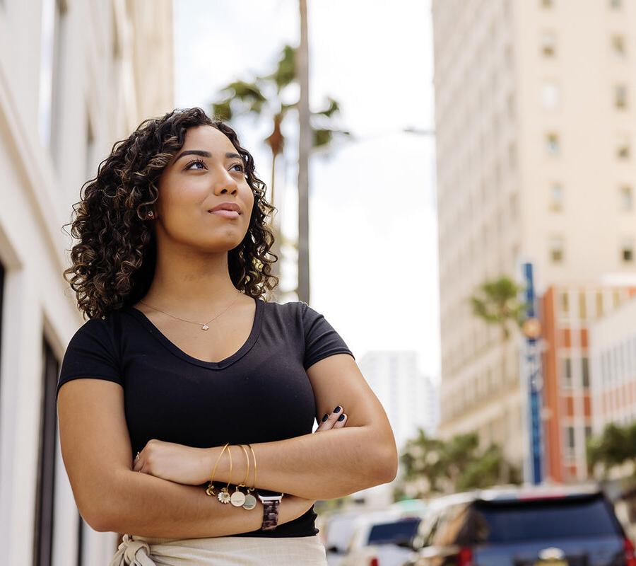 Student from Master of Accountancy 3+2 program stands outside in West Palm Beach.